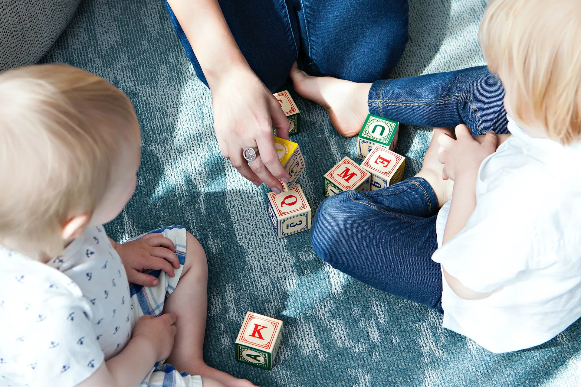 toddlers playing with block toys